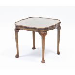 A square figured walnut coffee table raised on four carved cabriole legs,