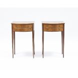 A pair of mahogany bowfront bedside tables of Sheraton design,