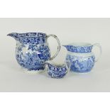A large blue and white punch jug, 19cm high, another jug and a sauce boat Condition Report: Largest