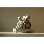 A Meissen white glazed porcelain mantel clock with circular dial,