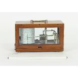 A barograph in a glazed mahogany case,