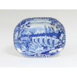 A Fisherman pattern blue and white meat dish with village behind a six arched bridge, 47cm wide