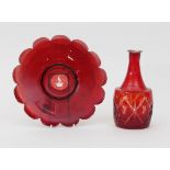 A ruby glass crested plate, 23cm diameter and a carafe,