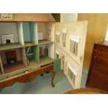 A Victorian doll's house, with gable roof and dormer window, 134cm wide/Provenance: Plas Gwyn,