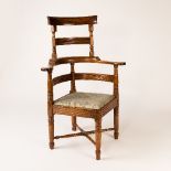 A mahogany barber's chair, circa 1830, with high back on turned legs, 106.