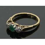 An emerald and diamond 18ct gold ring