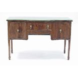 A mahogany sideboard of Sheraton design, fitted a drawer and two cupboards to the serpentine front,