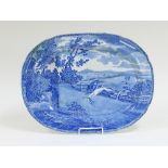 A Toft & May blue and white well dish, hare coursing scene with greyhounds and huntsman, 55cm wide