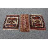 Two Hamadan mats with central geometric field, 56cm x 65cm and a small Caucasian mat,