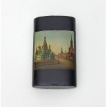 A Russian lacquer cheroot holder, Lukutin, depicting St Basil's, Moscow, 10cm long/see