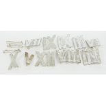 A boxed set of painted iron Roman numerals, each 15.