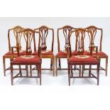 A set of mahogany dining chairs of 18th Century design,