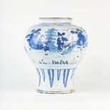 A large blue and white 18th Century delftware baluster vase painted in the Chinese transitional