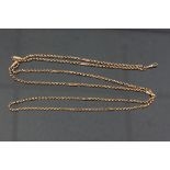 A 9ct gold guard chain, the faceted links interspersed by fetter type links,