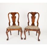 A pair of George I dining chairs, the vase shaped splats veneered in burr walnut with drop-in