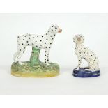 Two Staffordshire figures of dalmatians, 16cm and 13cm, a pair of Derby figures of cows and calves,