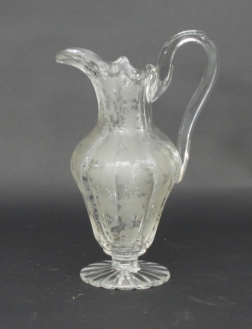 A fine cut glass jug, 19th Century, cut and engraved with vines, 30cm high/Provenance: Plas Gwyn,