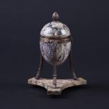 A marble egg shaped inkwell on a silver stand with concave tripod base, London 1910,