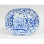 A Staffordshire blue and white dish, transfer printed figures on horses with country house beyond,