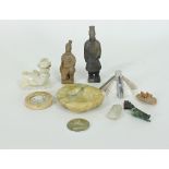 A group of various carved stone items to include a German diptych, onyx stylised figure,