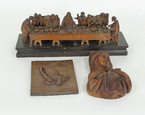 A carved wood scene of the Last Supper,
