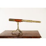 A Dolland of London two-draw brass telescope on folding brass tripod, 80cm extended/see illustration