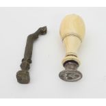 An ivory handled desk seal, 9.5cm long and a brass desk seal with horse hoof handle/Provenance: Plas