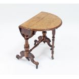 A Victorian burr walnut Sutherland table, the top and oval flaps inlaid with scrolls, on turned