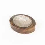 An early 18th Century horn box, the oval cover with white metal armorial plaque,