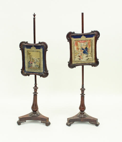 A near pair of Victorian rosewood pole screens,