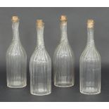 A set of four spiral fluted carafes, 28cm high/Provenance: Plas Gwyn,