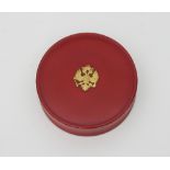 A Russian red lacquer circular box, Vichnyakov, bearing the two headed eagle boss,