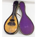 A mandolin in a case by G Grandini,