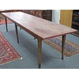 A French farmhouse table, the planked top on square tapering legs,