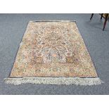 A Kashmir style wool rug with central tree of life design on a white ground within a figured border,