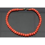 A red coral bead necklace, of 51 beads strung with screw clasp, 39.5cm long Condition Report: Approx