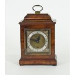 An Elliot walnut cased mantel clock, retailed by Camerer Cuss & Co, London, stamped beneath 2823,