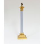 A gilt brass and plastic Corinthian column table lamp