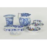 A Staffordshire blue and white toothbrush box and cover, a vase with flanged top, a jug,