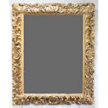 A mid 19th Century carved and giltwood wall mirror,