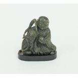 A Chinese soapstone carving of Buddha and a lion,