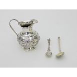 A Russian silver gilt spoon with scroll decoration in niello to the back of the bowl,