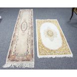 A Chinese rug, 220cm x 115cm and a Chinese runner,