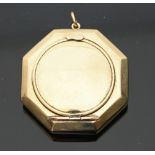 A lady's 9ct gold compact, of octagonal shape, the hinged cover fitted a mirror, 4.