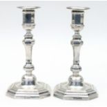 A pair of 18th Century style silver candlesticks, T B & S, Sheffield 1915,