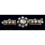 A Russian diamond brooch, the central nine-stone cluster flanked by rectangular sections,