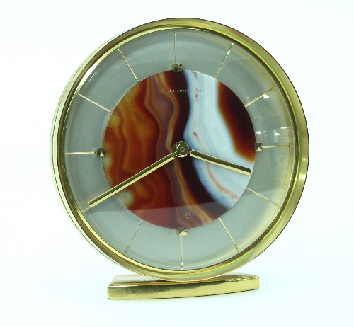 A Jaeger LeCoultre desk clock, of 1970s design, the circular dial centred by a banded agate panel,