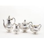 A Victorian four-piece silver tea set, the teapot and coffee pot, London 1856,