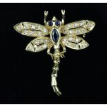 An 18ct gold and gem set dragonfly brooch, the eyes and body set sapphires, the wings with diamonds,