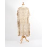 A 1920s cream chiffon dress of tabard style cut,